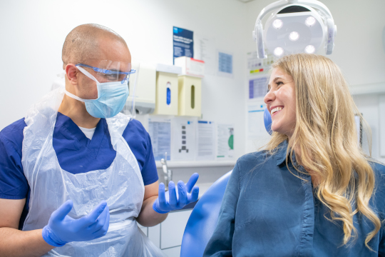 Woman with dentist with PPE