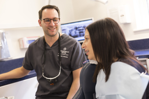 Dentist speaking to a patient