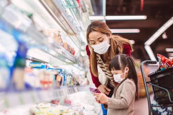 adult and child grocery shopping