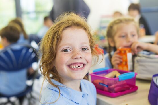child smiling at school