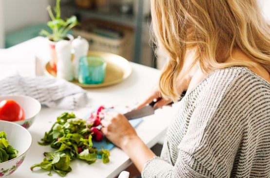woman cutting vegetables