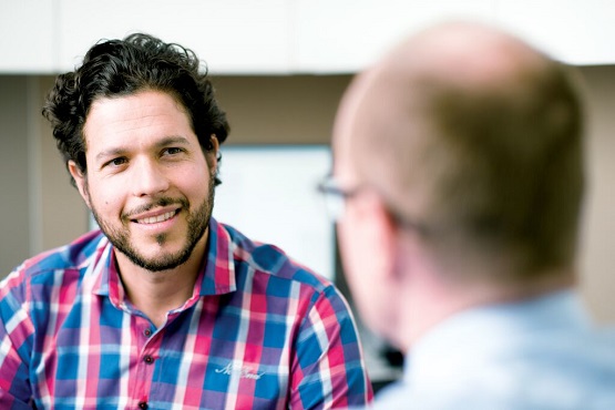 a man talking to a doctor