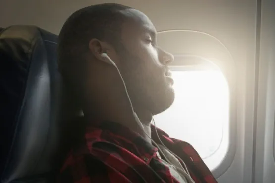 person sleeping on plane