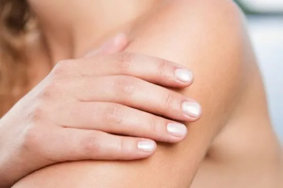 woman checking mole