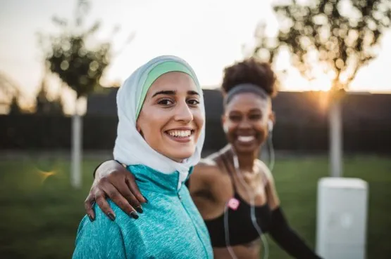 two friends jogging in the park