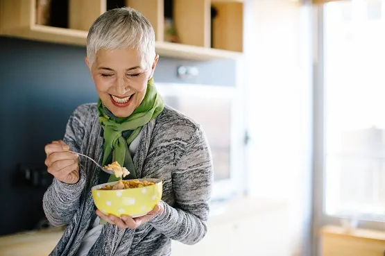 woman eating breakfast from a bowl