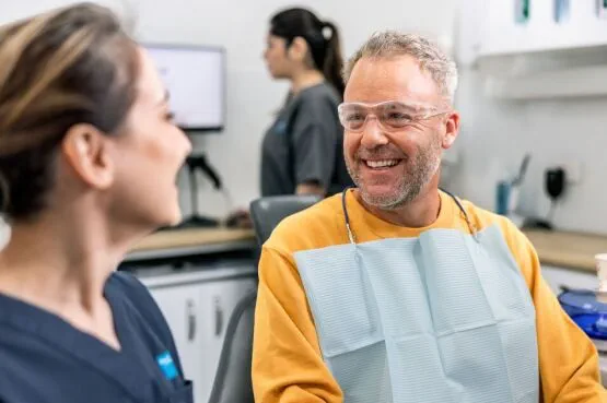 two dentist colleagues smiling at work