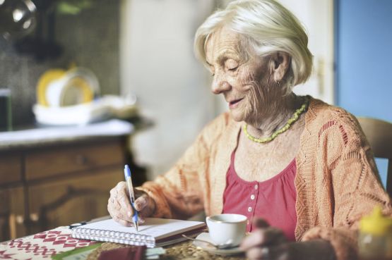 an older lady writing