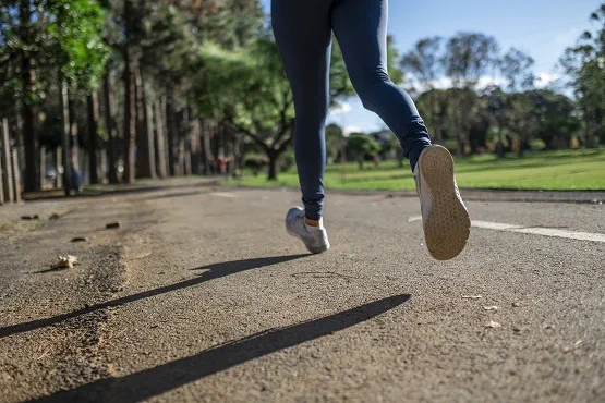 a woman running outdoors