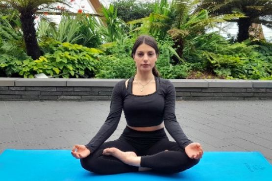 woman sitting in a yoga pose
