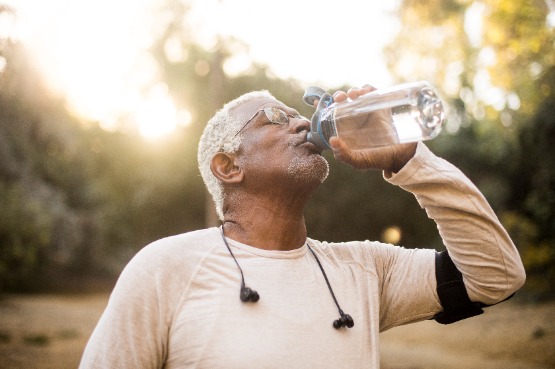 Adult drinking water from a bottle