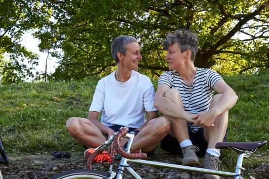 two cyclists taking a break
