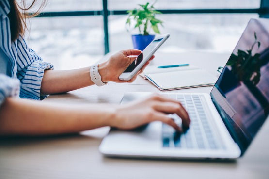 woman typing on a laptop
