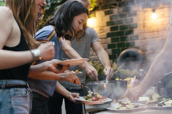 people having a barbeque outdoors