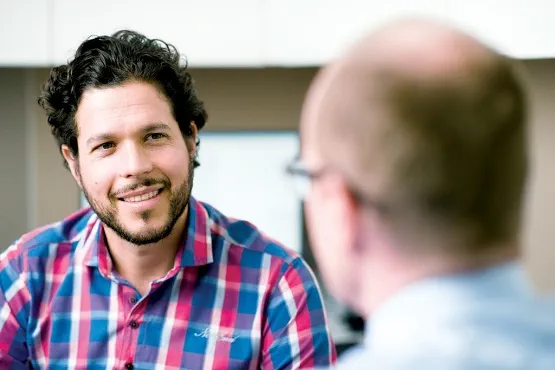 a man talking to a doctor
