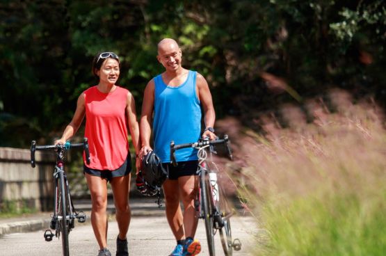 two people with cycles in the park