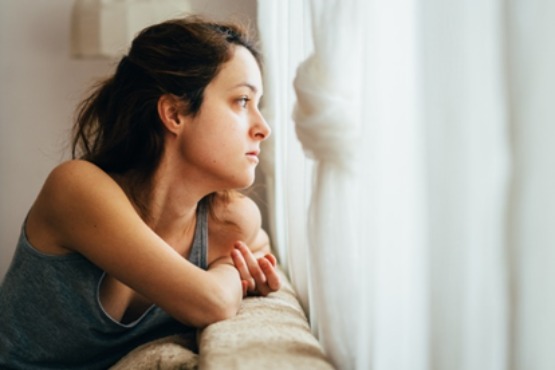 woman looking out of the window