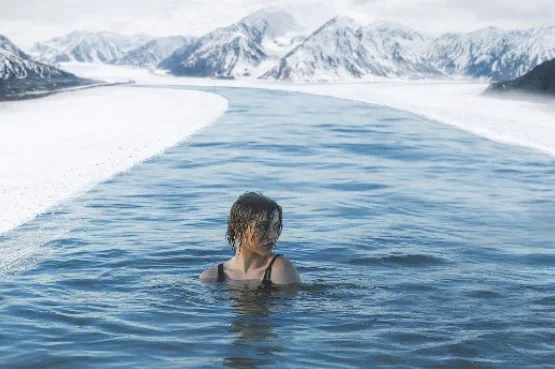 woman swimming in ice cold water