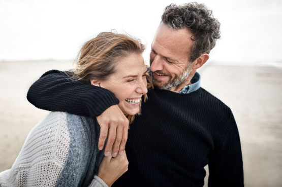 two people having fun at the beach