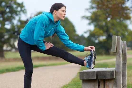 person stretching before exercise outdoors