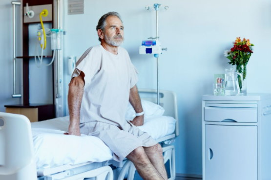 person sitting on a hospital bed
