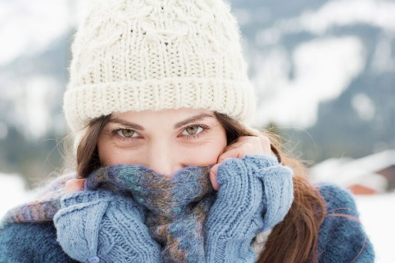 person wrapped in a scarf outdoors