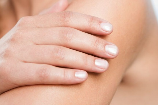 close up of hand on arm