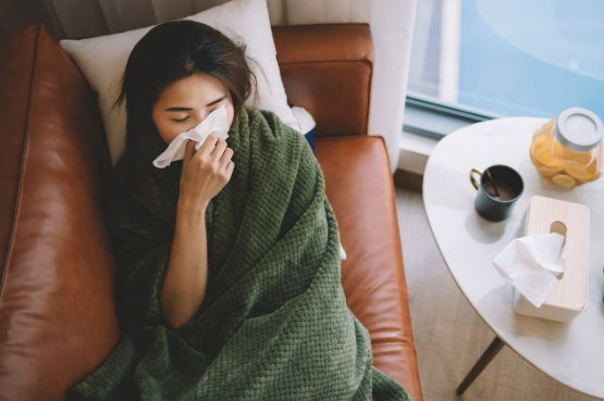 person lying on the couch feeling unwell
