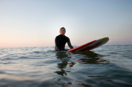 person waiting for a wave while surfing