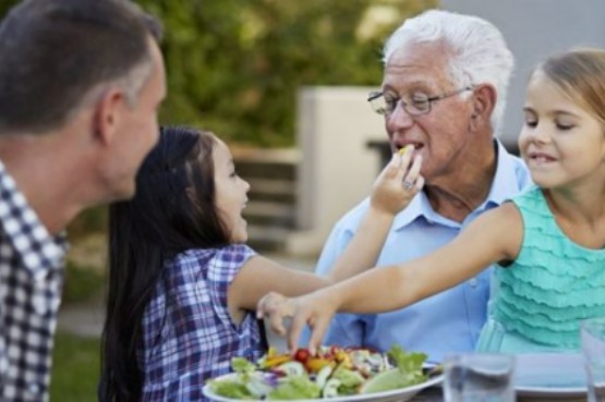 family eating together outdoors