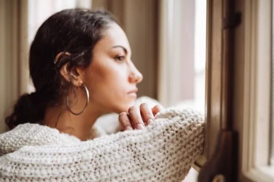 person gazing out of the window