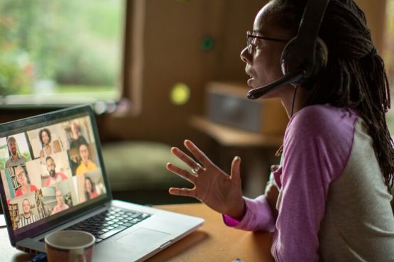 person taking a work video call from home
