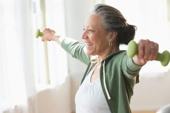 person working out with dumbbells indoors