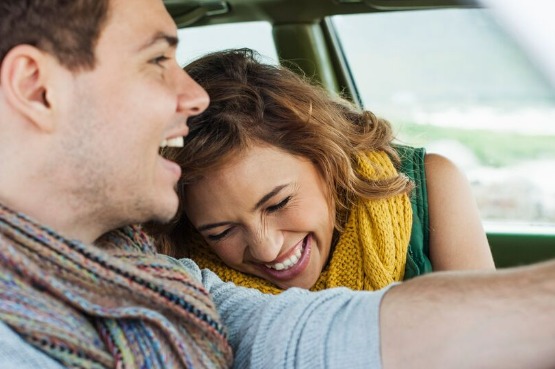 two people enjoying a car drive