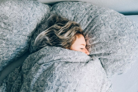 person sleeping in bed
