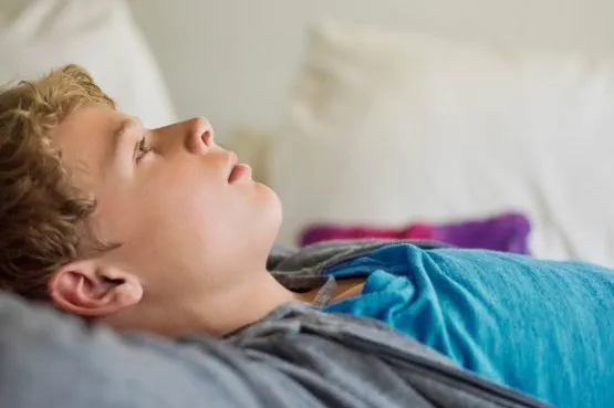 teen day dreaming in bed