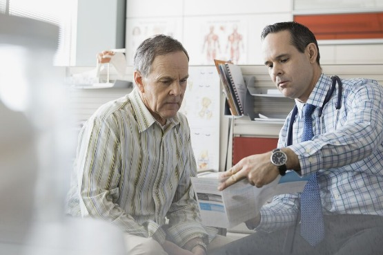 doctor going over a report with a patient