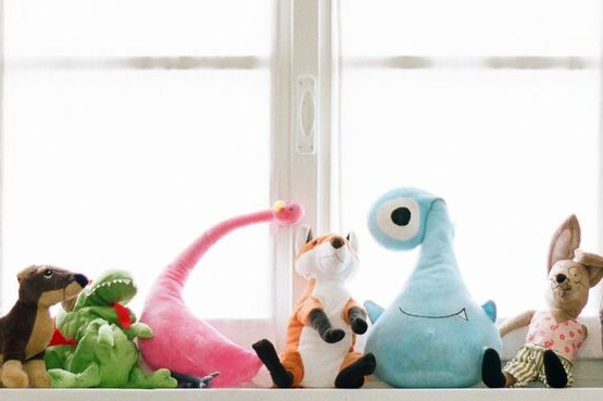plushies on a window seat