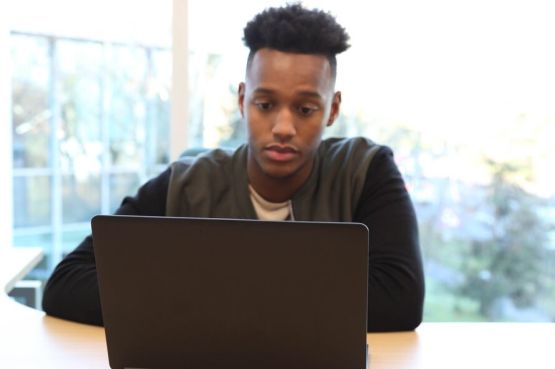 teenager on a laptop