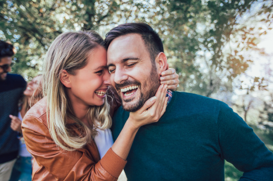 a happy couple laughing