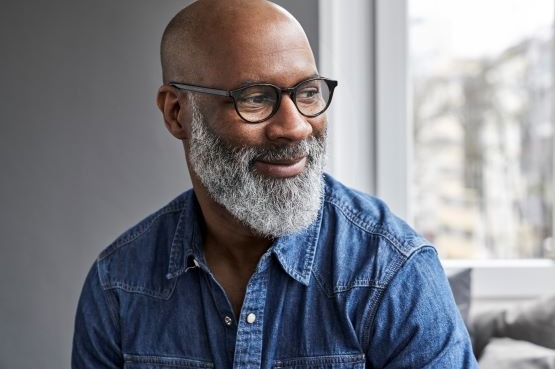 man in blue shirt and glasses