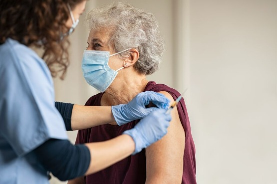 older person getting vaccinated