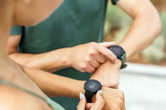 people looking at their fitbits