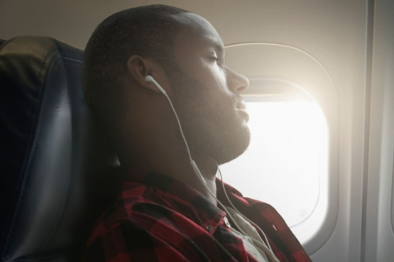person sleeping on plane