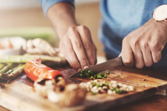 cutting vegetables on a chopping board