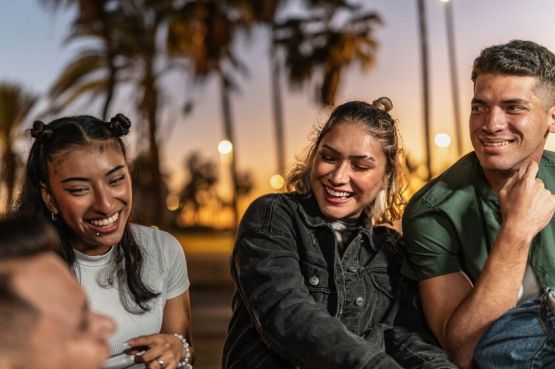 group of young people chatting outdoors