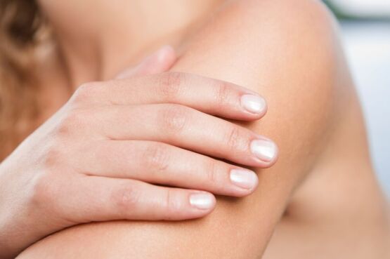 woman checking mole