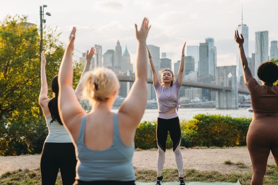 Group doing yoga outside