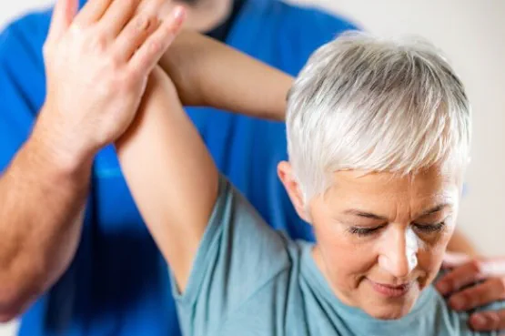 shoulder stretches guided by a physio
