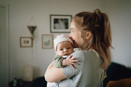 mother holding new born